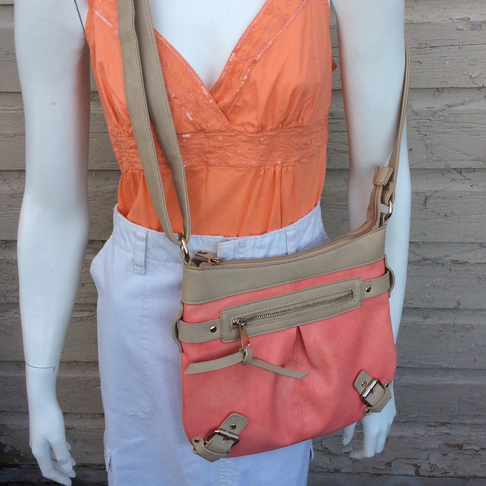 Charming Charlie cross-body bag in peachy pink/tan